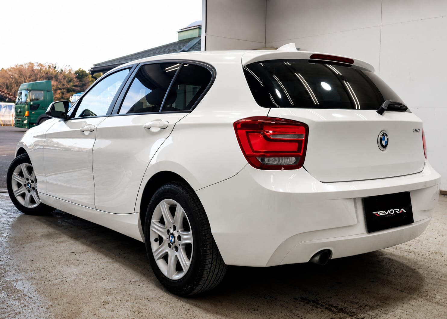 2015 BMW 1 Series 116i, rear three-quarter view